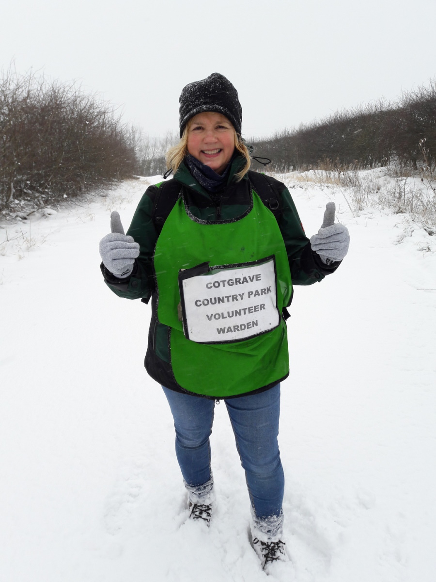 Roxy, a volunteer warden, walking in the snow